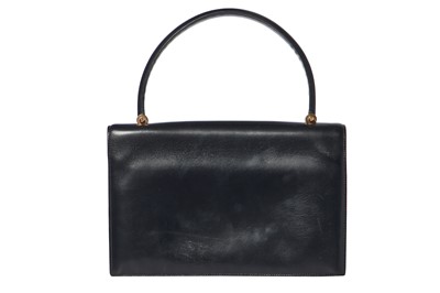 Lot 56 - An Hermès navy leather bag, 1959