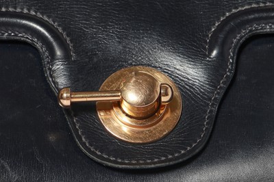 Lot 56 - An Hermès navy leather bag, 1959