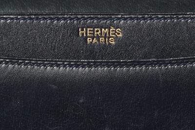 Lot 56 - An Hermès navy leather bag, 1959