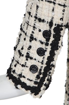 Lot 4 - A Chanel black and white bouclé tweed suit, Cruise collection 2003