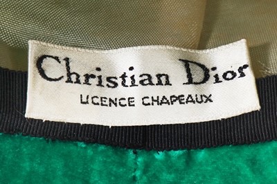 Lot 355 - A Christian Dior hat in emerald-green velvet, circa 1960