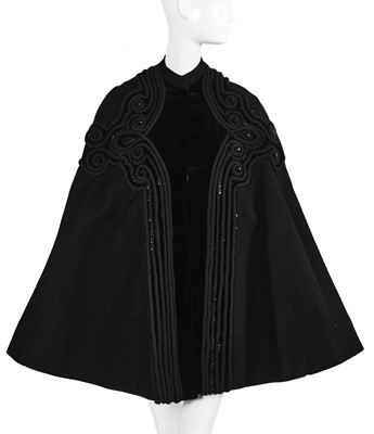 Lot 121 - A Pierre Balmain couture black wool cape, circa 1950