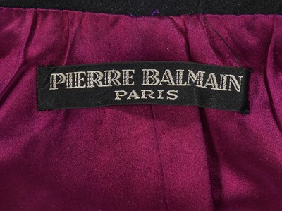 Lot 121 - A Pierre Balmain couture black wool cape, circa 1950