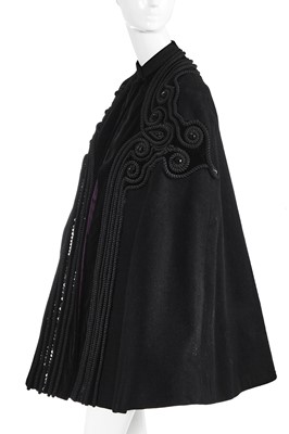 Lot 121 - A Pierre Balmain couture black wool cape, circa 1950
