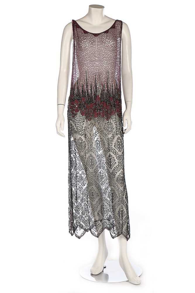Lot 365 - A pink and black beaded tunic dress, mid 1920s,...