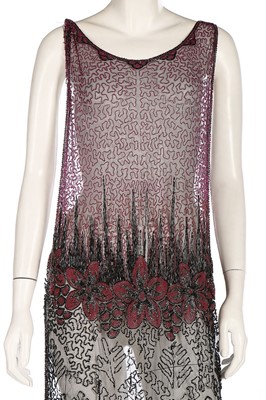 Lot 365 - A pink and black beaded tunic dress, mid 1920s,...