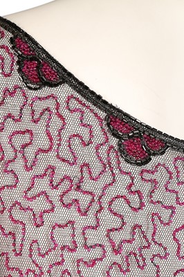 Lot 365 - A pink and black beaded tunic dress, mid 1920s,...