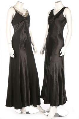 Lot 376 - A black satin-backed crepe bias cut gown,...