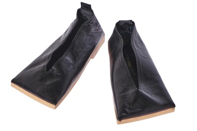 Lot 320 - A pair of rare Comme des Garçons 'flat' black leather shoes, circa 1985