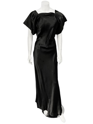 Lot 85 - A Worth couture black satin bias-cut evening gown, early 1930s