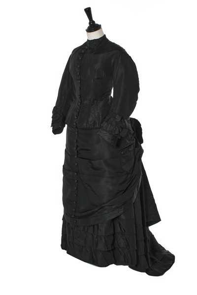 Click for high resolution Lot 282 - A black faille mourning gown, late 1870s,...