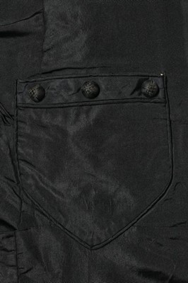 Lot 282 - A black faille mourning gown, late 1870s,...