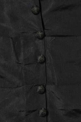 Lot 282 - A black faille mourning gown, late 1870s,...