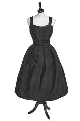 Lot 105 - A Christian Dior black faille evening gown, mid 1950s