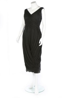 Lot 383 - A Norman Hartnell couture draped black jersey...