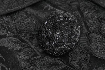 Lot 317 - A Nina Ricci haute couture black damask satin evening coat, 1950s