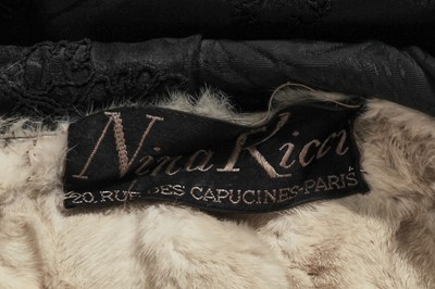 Lot 317 - A Nina Ricci haute couture black damask satin evening coat, 1950s