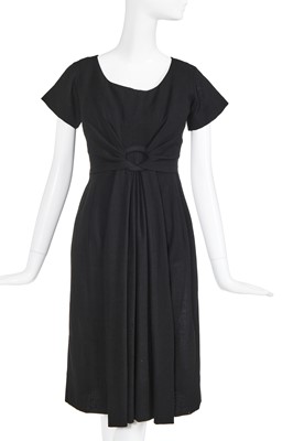 Lot 115 - A Christian Dior black crêpe dinner dress, circa 1958