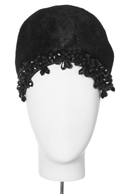 Lot 149 - A black plush skull cap, early 1960s