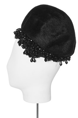 Lot 149 - A black plush skull cap, early 1960s