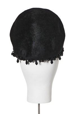 Lot 149 - A black plush skull cap, early 1960s