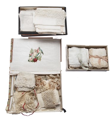 Lot 411 - A leather bound canvas trunk containing lace trimmings, men's shirts and lingerie
