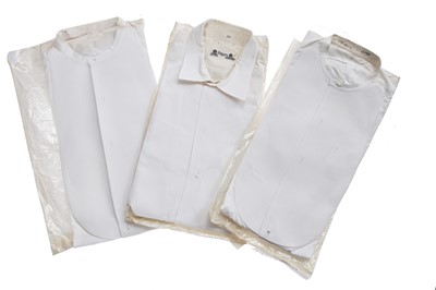 Lot 411 - A leather bound canvas trunk containing lace trimmings, men's shirts and lingerie