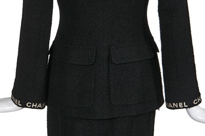 Lot 24 - A Chanel black bouclé wool suit, Autumn-Winter 1995-96