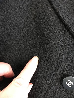 Lot 24 - A Chanel black bouclé wool suit, Autumn-Winter 1995-96