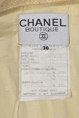 Lot 26 - A Chanel pale yellow bouclé suit, early 1990s