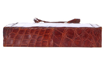 Lot 67 - A brown crocodile handbag, circa 1945 used in the film 'Evita', 1996
