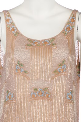 Lot 365 - A beaded peach muslin bridesmaid/flapper dress, circa 1928