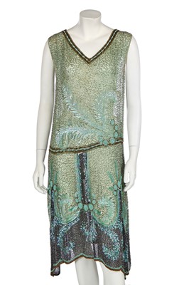 Lot 383 - A fine beaded green muslin flapper dress, circa 1928