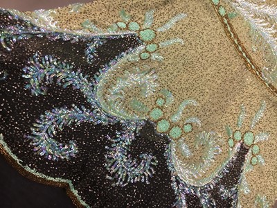 Lot 383 - A fine beaded green muslin flapper dress, circa 1928
