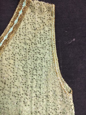 Lot 383 - A fine beaded green muslin flapper dress, circa 1928