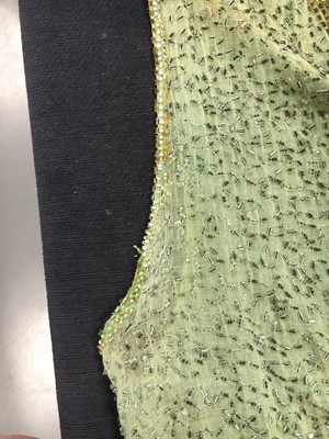 Lot 383 - A fine beaded green muslin flapper dress, circa 1928
