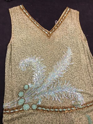 Lot 383 - A fine beaded green muslin flapper dress, circa 1928
