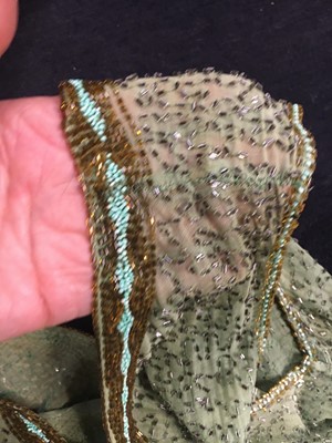 Lot 383 - A fine beaded green muslin flapper dress, circa 1928