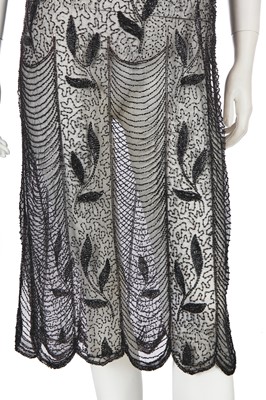 Lot 385 - A beaded tabard and jacket, 1920s