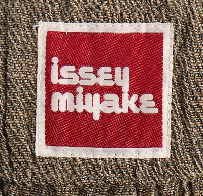 Lot 415 - An Issey Miyake crinkle-weave jacket,...