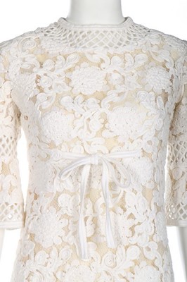 Lot 236 - A Pierre Balmain white soutache lace dress,...
