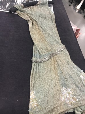 Lot 367 - A beaded green muslin flapper dress circa 1928