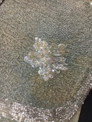 Lot 367 - A beaded green muslin flapper dress circa 1928