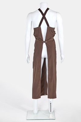 Lot 163 - A Jean Paul Gaultier men's brown polyester apron, modern