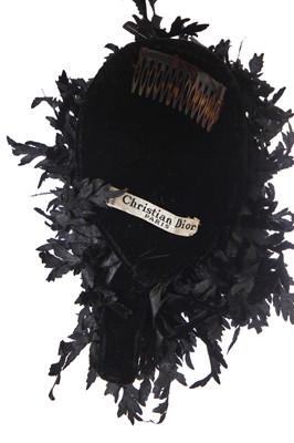 Lot 323 - A Christian Dior black silk hat, 1950s