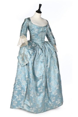 Lot 475 - A turquoise-blue brocaded satin robe a...