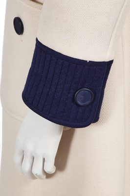 Lot 293 - An André Courrèges navy and cream coat, early 1970s