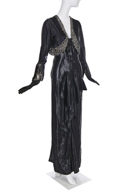 Lot 462 - A Norman Hartnell black ciré satin evening gown, circa 1930