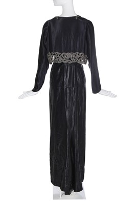 Lot 462 - A Norman Hartnell black ciré satin evening gown, circa 1930
