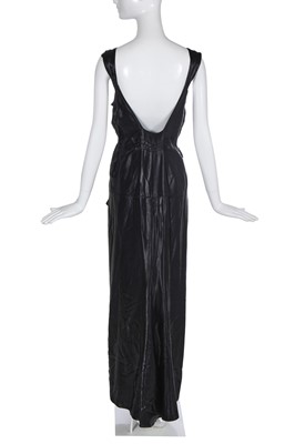 Lot 462 - A Norman Hartnell black ciré satin evening gown, circa 1930